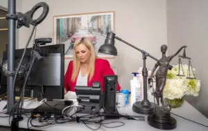 Wilkes-Barre workers' compensation lawyer Caroline Munley working at her desk