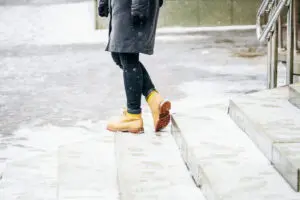 person walking on icy steps in Reading