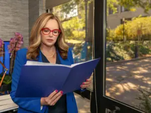 Attorney Marion Munley reading from a file