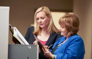 caroline munley speaking with an office worker