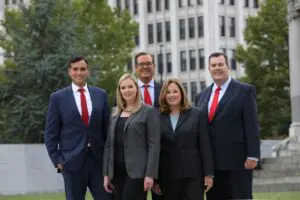 The Philadelphia pedestrian accident lawyer team at Munley Law stands together in their office. This image highlights the trusted attorneys who help injured pedestrians recover compensation. Call 855-866-5529 to speak directly with a legal professional. The photo showcases professionalism, legal expertise, and a client-first focus.
