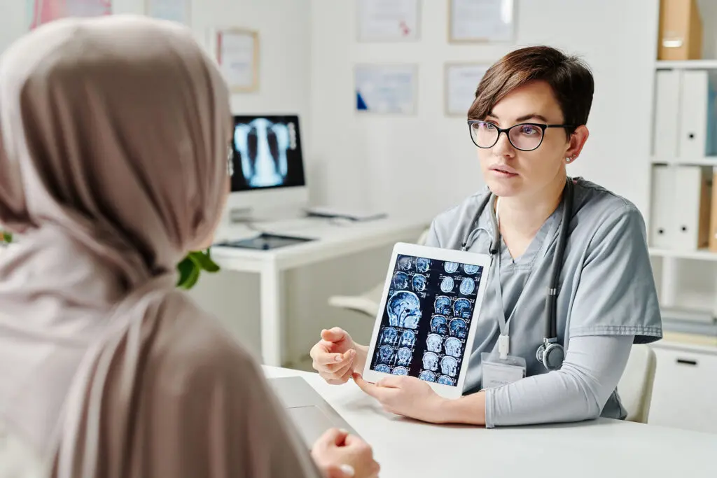 Doctor shows traumatic brain injury patient their xrays in Reading, PA