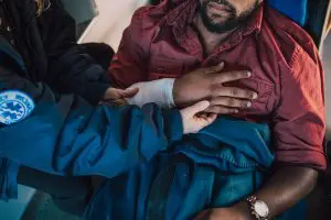emergency personnel helping injured victim