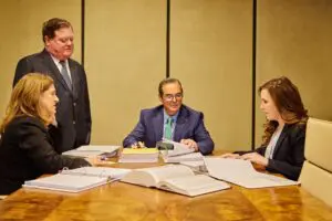 Munley workers' compensation lawyers discussing worker's comp claim.
