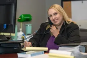 attorney katie nealon working at her desk