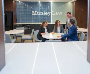 Professional meeting room at Munley Law Personal Injury Attorneys in Scranton, PA, available by contacting (570) 865-4699. The image depicts an organized office space featuring a clean conference table, coffee mugs, legal pads, and comfortable seating designed for client meetings and legal consultations. Munley Law provides expert representation in Scranton for victims involved in truck accident cases, ensuring thorough and professional preparation. The environment shown reflects Munley Law’s commitment to assisting clients with truck accident settlements.