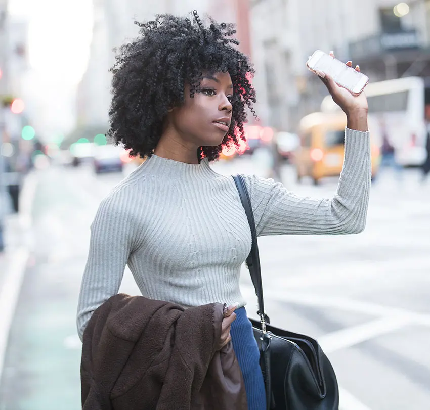 Woman waiting for her rideshare driver