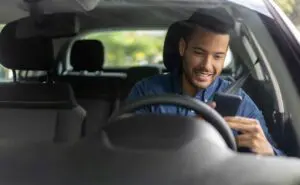 Interior of an Uber vehicle showing the front seat and dashboard. Munley Law in Scranton, PA, at 855-866-5529, represents clients involved in distracted driver accidents. Distraction is common in rideshare incidents, and Munley Law ensures fair compensation. This image illustrates potential distractions faced by rideshare drivers.