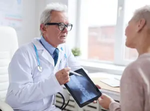 Doctor explaining a spinal cord injury to a patient in Allentown