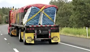 And overloaded truck driving down the road