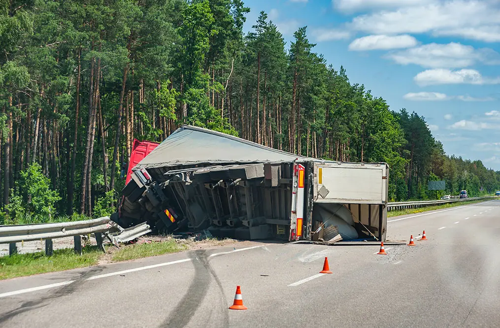 truck flipped on its side after a semi truck accident