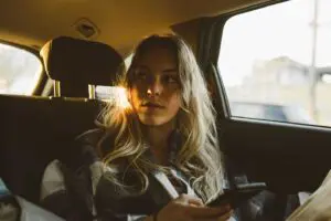Interior view of an Uber vehicle immediately after an accident, clearly showing the back seat and windows. This image highlights the common setting for accidents involving rideshare vehicles. Provided by Munley Law, expert Uber accident lawyers in Scranton, PA, available 24/7 at 855-866-5529. Munley Law assists clients dealing with personal injuries from Uber accidents.