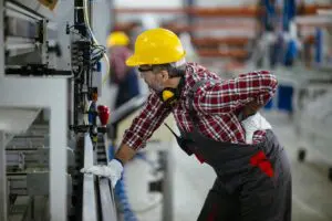 A warehouse worker in Allentown experiences significant back pain due to repetitive work duties, illustrating the need for workers' compensation benefits. Munley Law, an experienced workers' compensation attorney firm in Allentown, assists injured workers in securing medical and wage loss benefits. If you suffer from a workplace-related back injury, contact Munley Law at 855-866-5529 for a free consultation about your workers' compensation claim in Allentown, Pennsylvania.