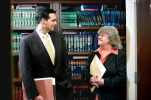 Pennsylvania wokers' compensation lawyer Robert Munley III speaks with a client