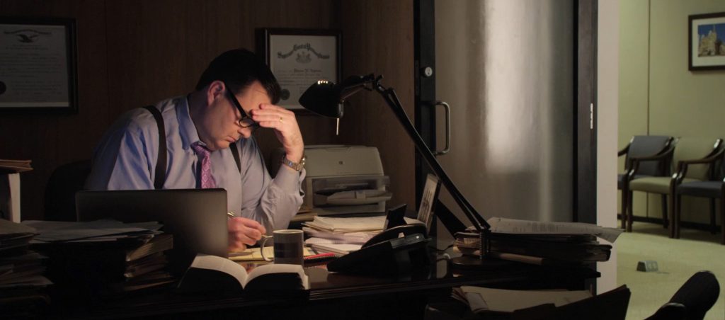 Reading workers' compensation lawyer working at his desk
