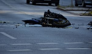 motorcycle lying on road following accident