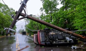 Common causes of car accidents, car over turned with telephone pole on road