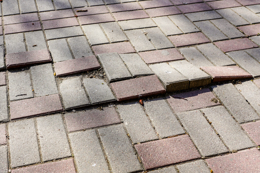 defective cobblestone pavement due to incorrectly prepared base