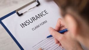 Insurance claim form on a clipboard