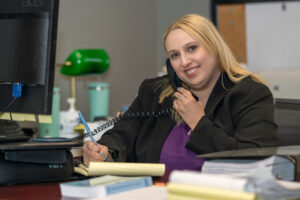 Williamsport personal injury lawyer Katie Nealon speaking on the phone with a client