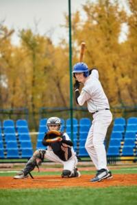 two boys playing baseball