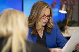 A dedicated traumatic brain injury lawyer at Munley Law reviewing case documents with a client. The attorney carefully analyzes details to provide comprehensive legal guidance. Munley Law supports clients dealing with traumatic brain injury claims in Allentown, PA.