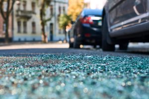 Broken glass at the scene of a recent auto accident