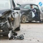 Scene of a severe car accident causing significant vehicle damage, frequently leading to brain injuries. Munley Law’s brain injury attorneys in Philadelphia, PA help victims secure fair compensation after motor vehicle accidents. For legal help, contact Munley Law at 215-515-7747.