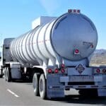 A tanker truck driving down the highway