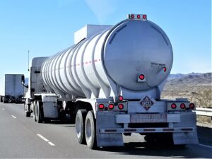 A tanker truck driving down the highway