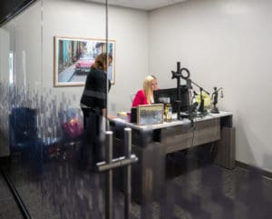 A Wilkes-Barre workers' compensation lawyer discusses case with a paralegal