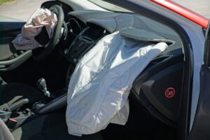 Car with driver and passenger airbags deployed after an accident
