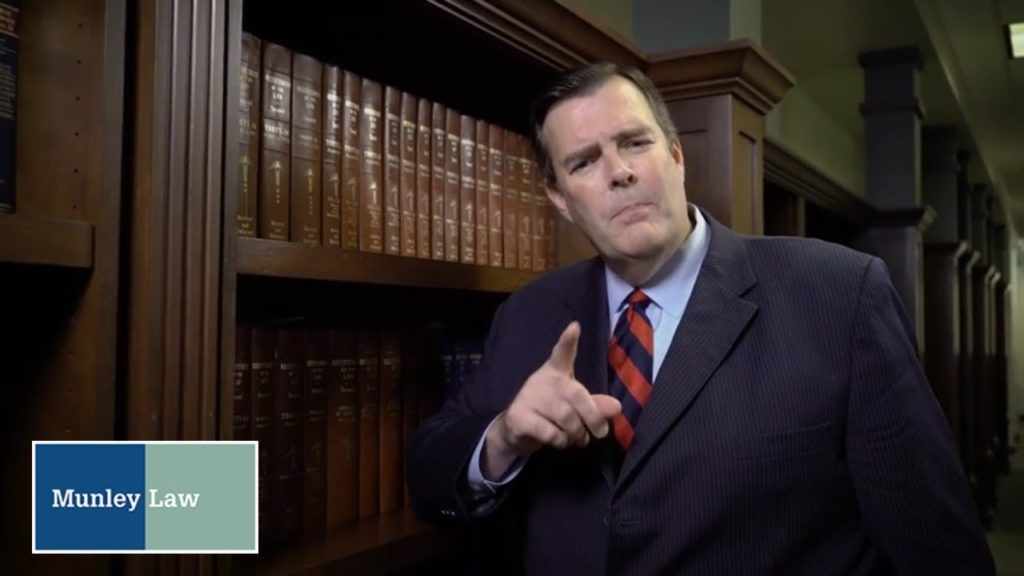 Pittsburgh product liability attorney standing next to bookcase