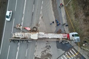 Truck lying on its side across 4 lines of highway