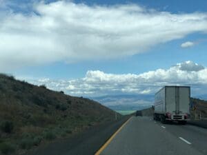 A truck on an Oregon highway; call Munley Law for a free consultation with a truck accident lawyer
