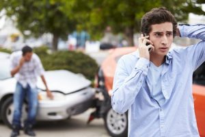 Teenager that had a car accident speaking on the phone with his lawyer
