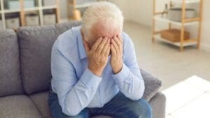 This image portrays an empty, softly lit living room subtly symbolizing emotional distress after a truck accident. Subtle details such as slightly disarranged cushions hint at disrupted daily life experienced by victims. Munley Law in Scranton supports victims facing such emotional impacts, available at (570) 865-4699. The scene effectively communicates the emotional toll and life adjustments that accompany severe truck accident injuries.
