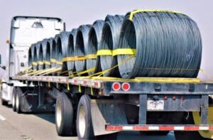 Flatbed truck transporting rolls of steel