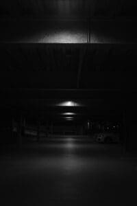 Interior shot of a dark parking garage