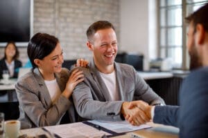 Couple shaking hands with a Wilkes-Barre truck lawyer and personal injury lawyers
